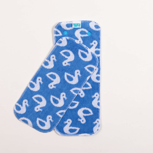 blue nappy booster pads flatlay