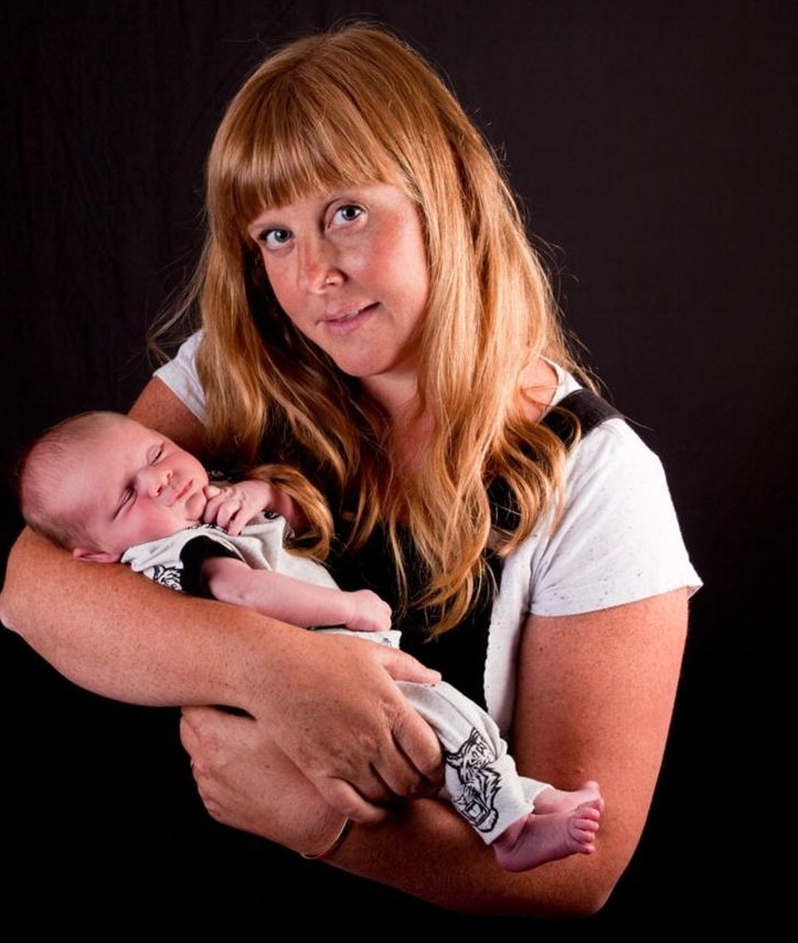 TotsBots Real Parent Sam holding her tot, Ted
