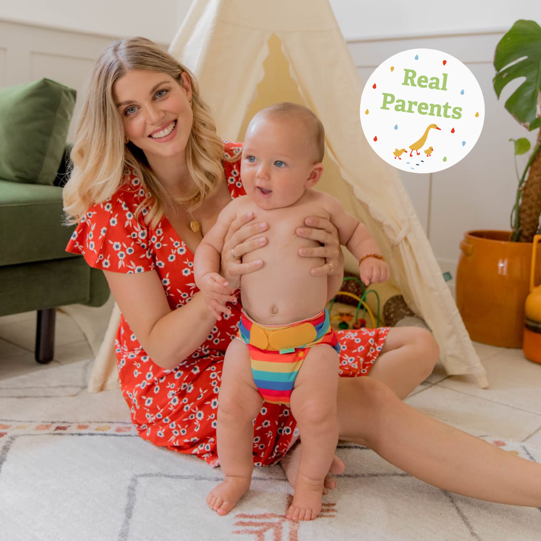Real Parent Ashley Louise James holding her baby, Alfie, wearing a reusable nappy