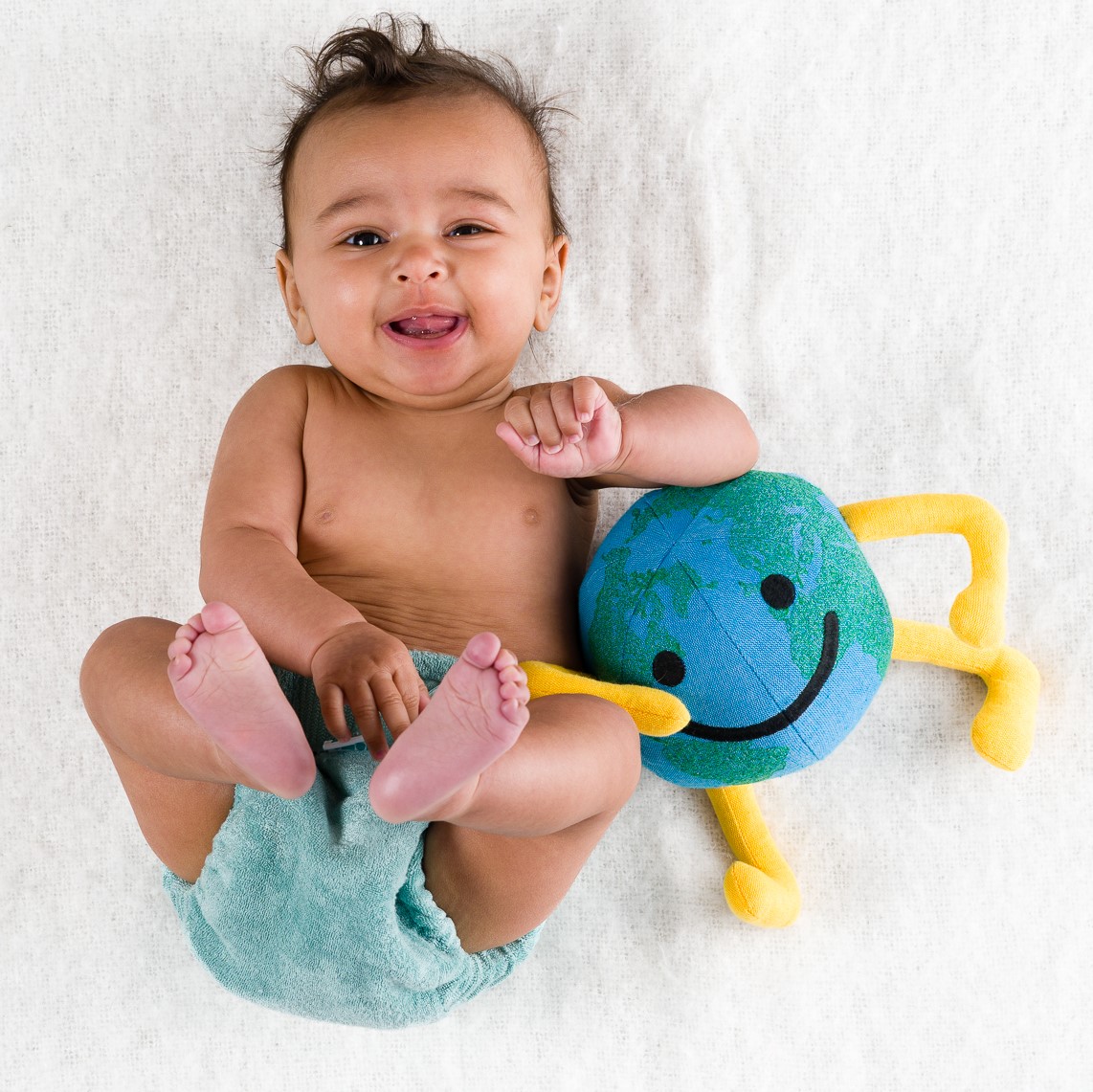 Baby with globe toy