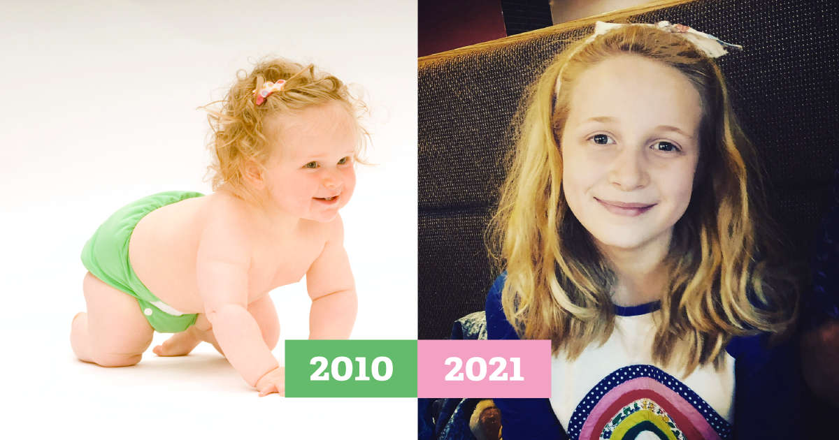 Side by side of a baby crawling in a green cloth nappy in 2010 then grown up smiling at the camera in 2021